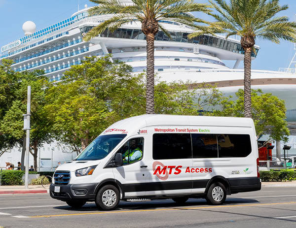 MTS Access vehicle parked with a cruise ship in the background