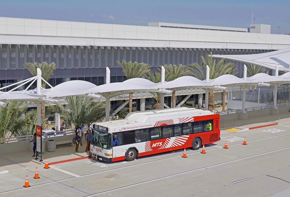 MTS Bus stopped on the side of the road on the elevated platform at the San Diego Airport