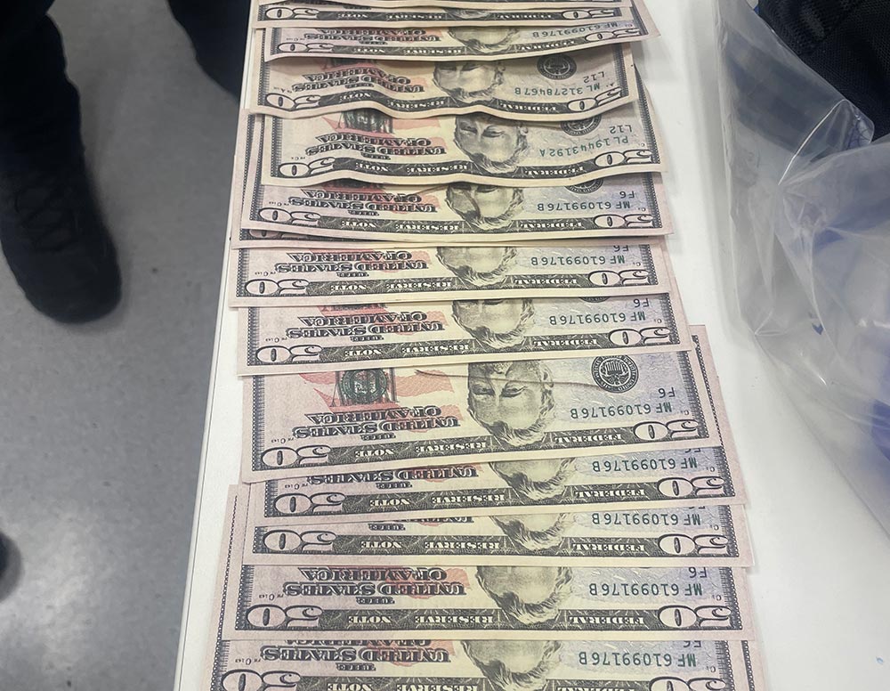 Counterfeit money displayed on a counter