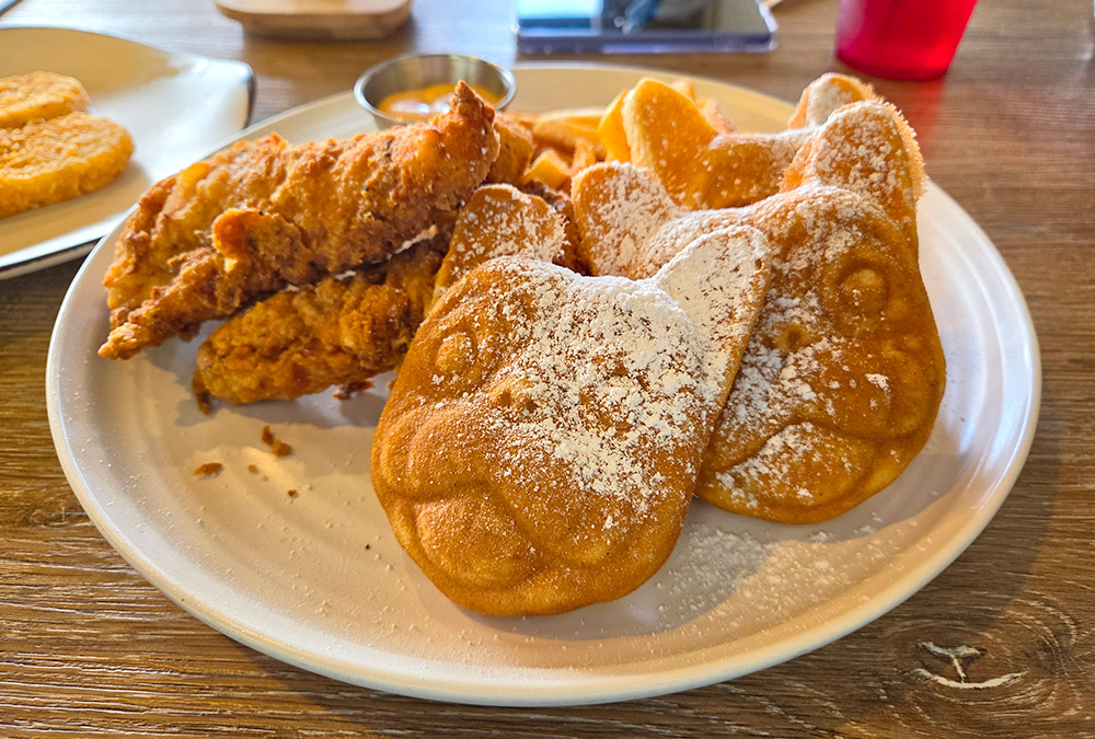 Dog shaped waffle on a plate at a restaurant