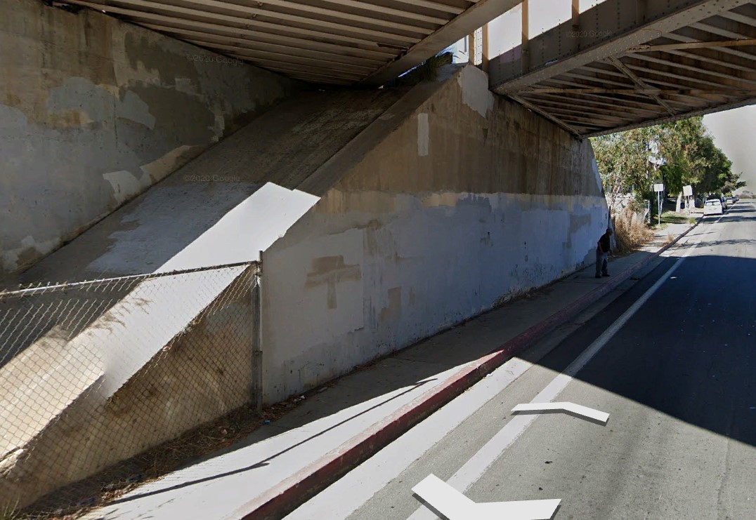 Image of dark underpass near the Beyer Blvd Trolley Station