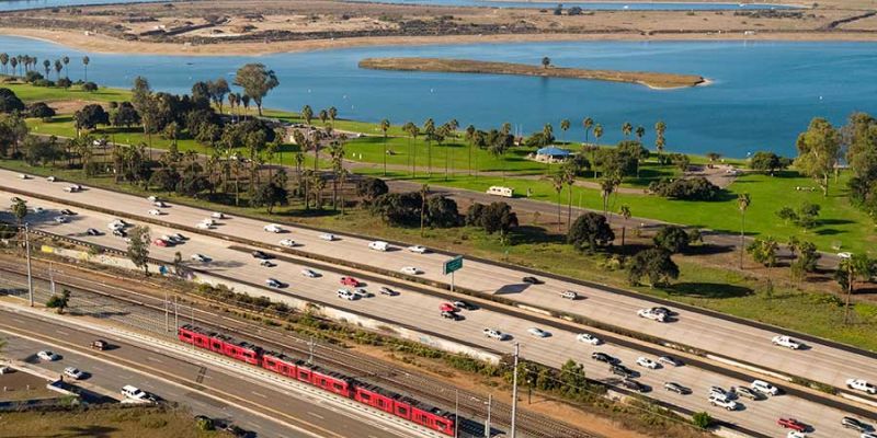 The UC San Diego Blue Line zooms by Mission Bay