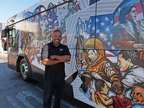 Artist Ibn Edwards with Black History Month MTS Bus