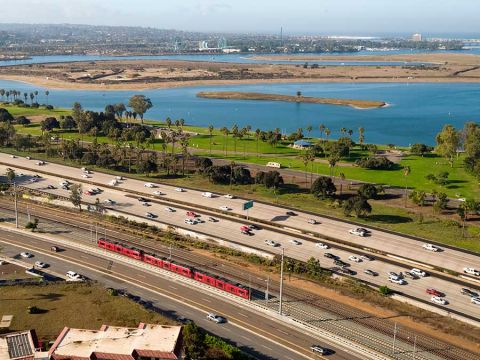 The UC San Diego Blue Line zooms by Mission Bay