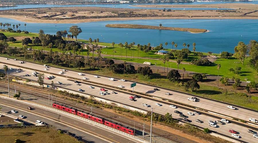 The UC San Diego Blue Line zooms by Mission Bay