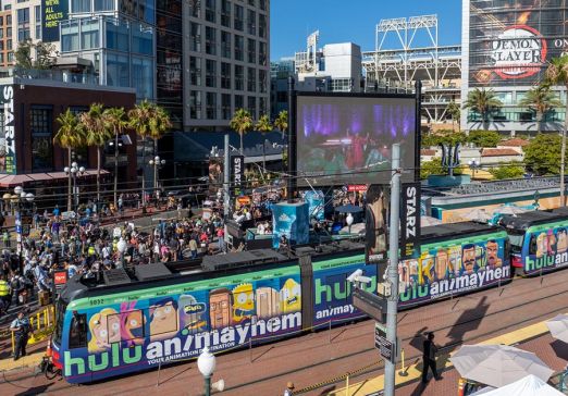 Hulu Wrapped Trolley at Gaslamp Quarter station during Comic-Con with a crowd in the background