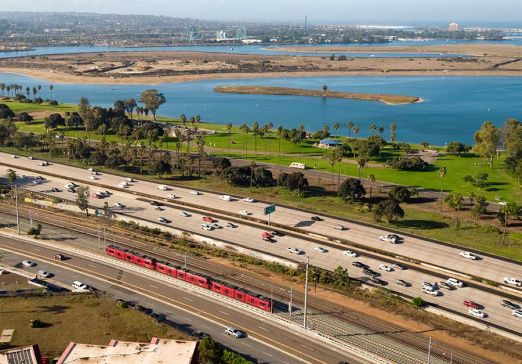 The UC San Diego Blue Line zooms by Mission Bay