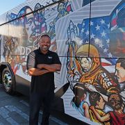 Artist Ibn Edwards with Black History Month MTS Bus