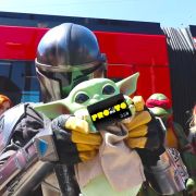 Grogu and the Mandalorian with the SDCC PRONTO card in front of the Trolley